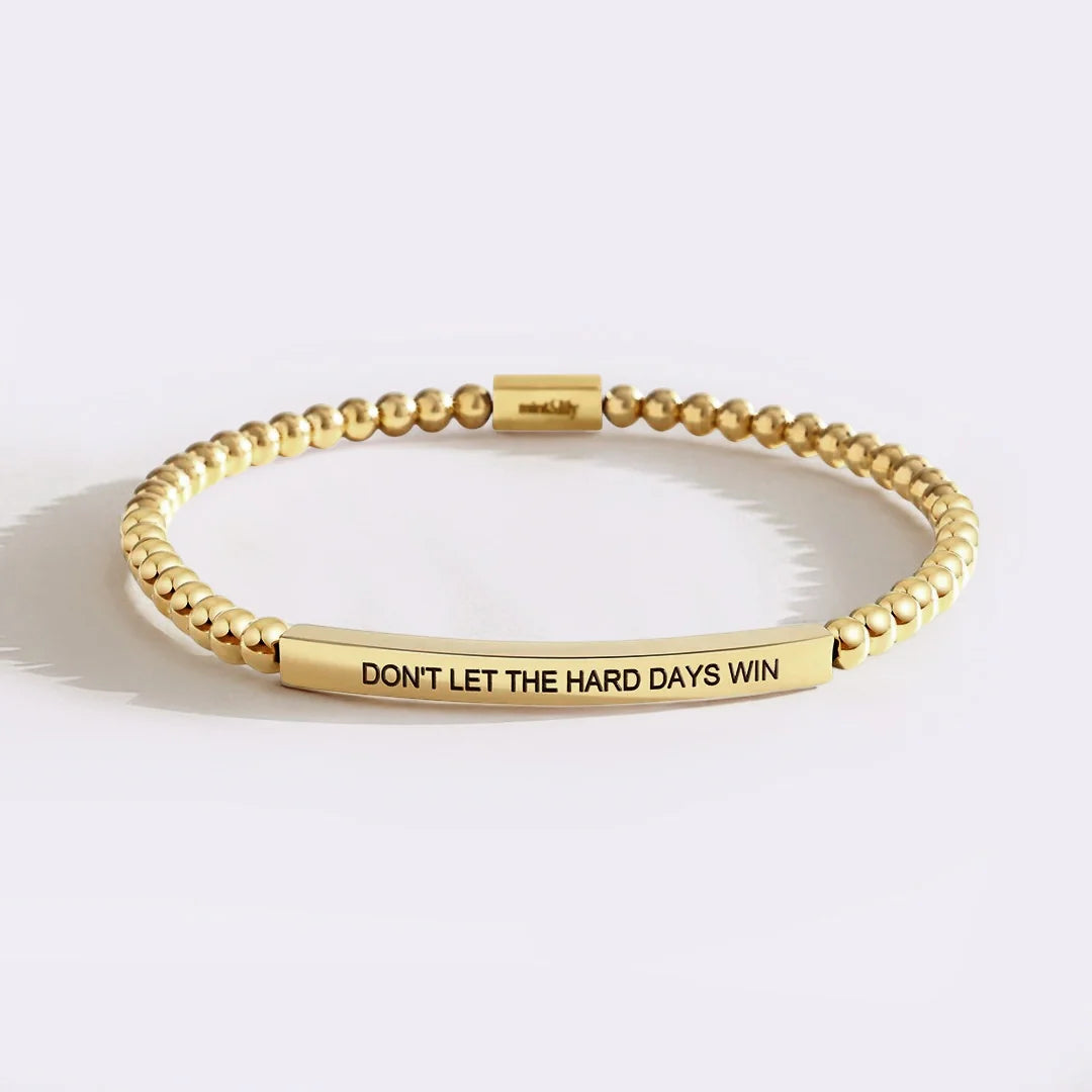 Strength meaning bracelet in gold finish