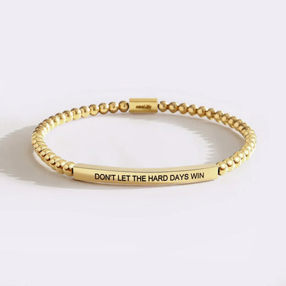 Strength meaning bracelet in gold finish